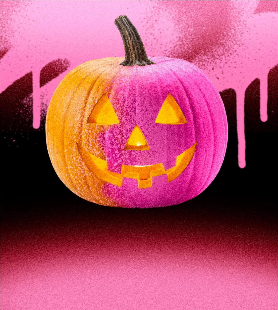 A carved pumpkin lit from inside, covered in pink paint